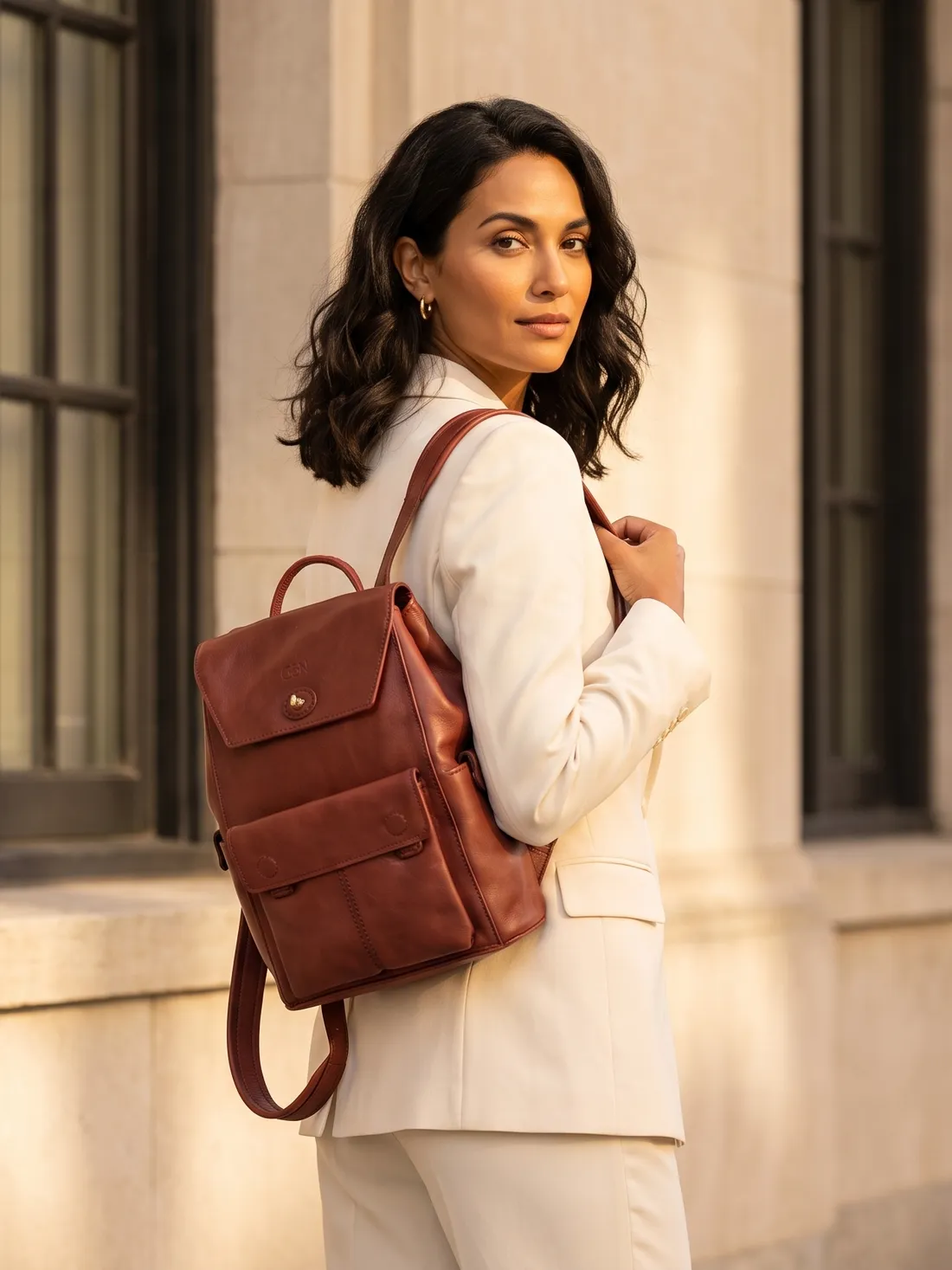 GÖN Handmade Leather Backpack worn — carried in Brick, from the campaign
