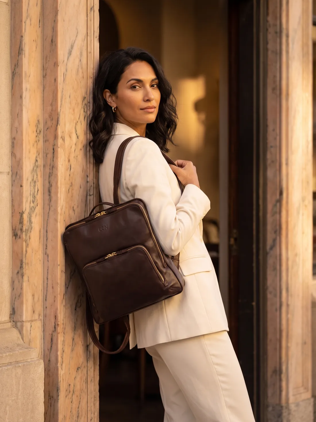 GÖN Handmade Everyday Leather Backpack worn — carried in Coffee, from the campaign