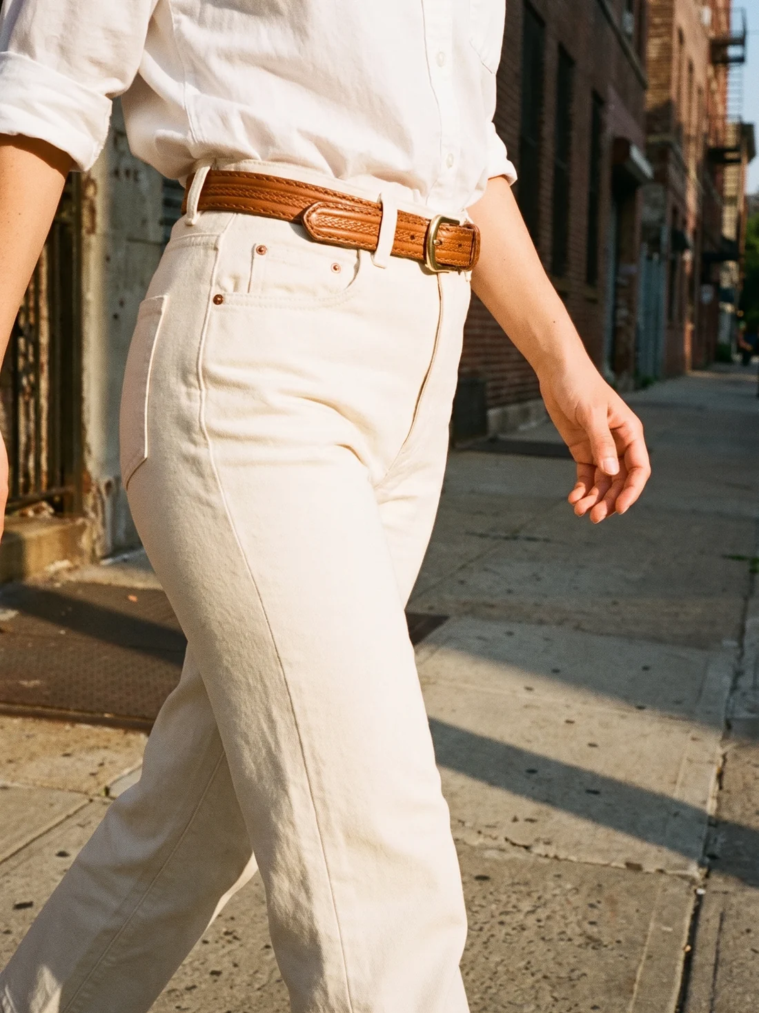 GÖN Handmade Tooled Leather Belt worn — carried in Tan, from the campaign