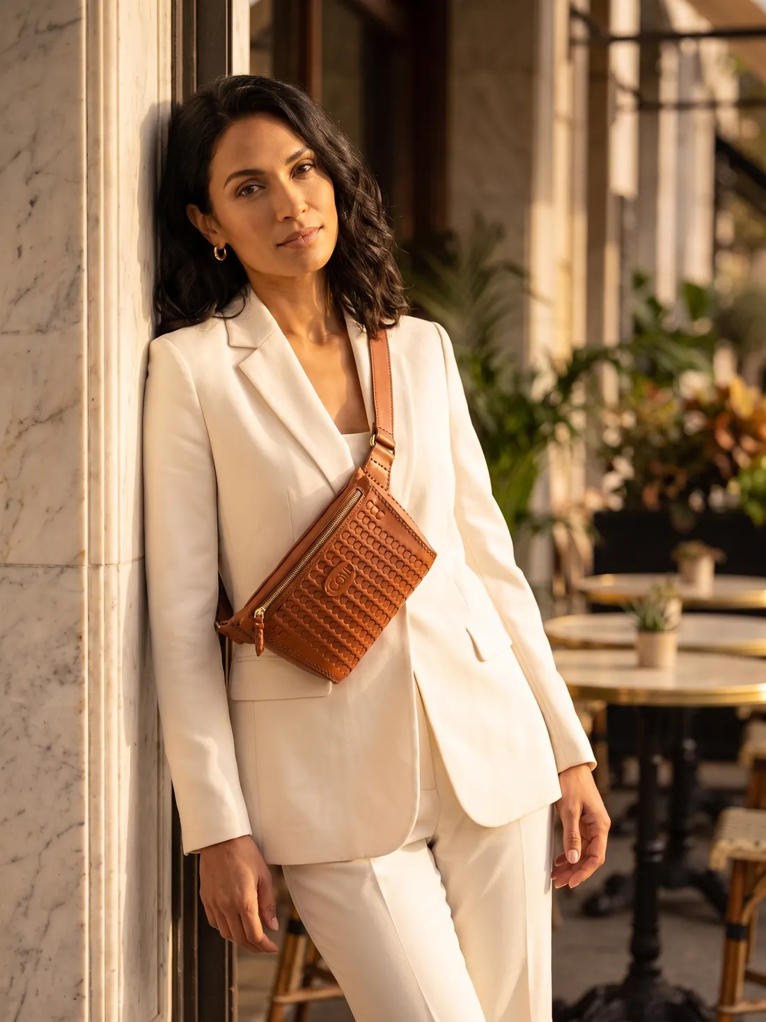 GÖN Handmade Ago Belt Bag worn — carried in Tan, from the campaign