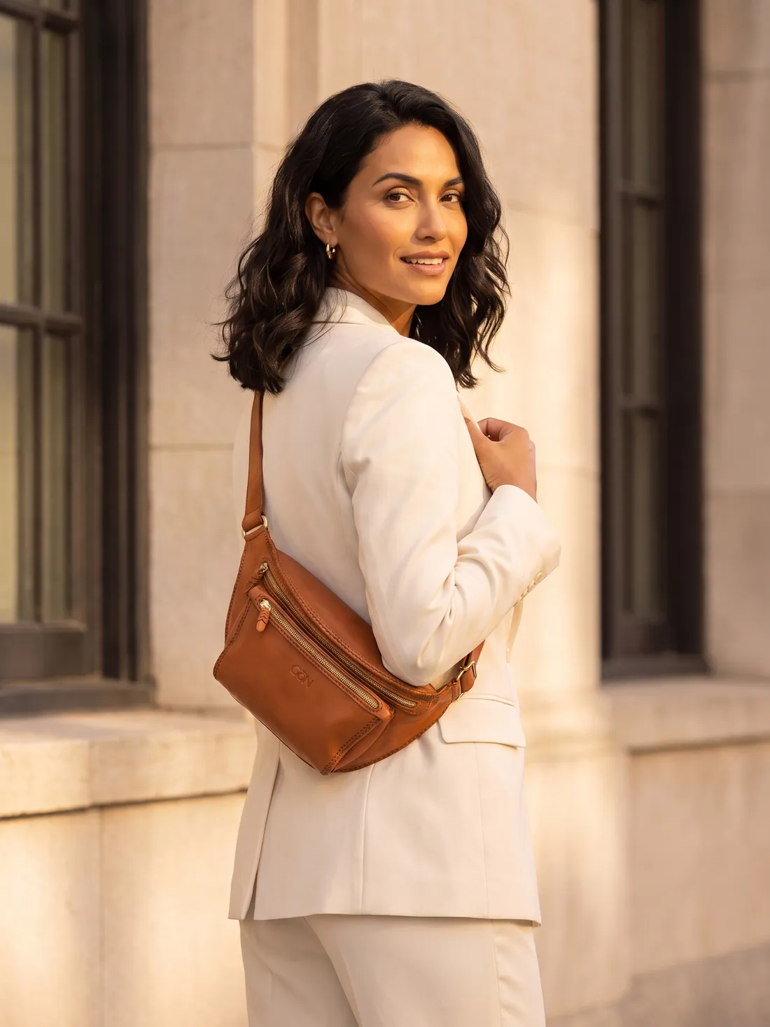 GÖN Handmade Double-Zip Belt Bag worn — carried in Tan, from the campaign