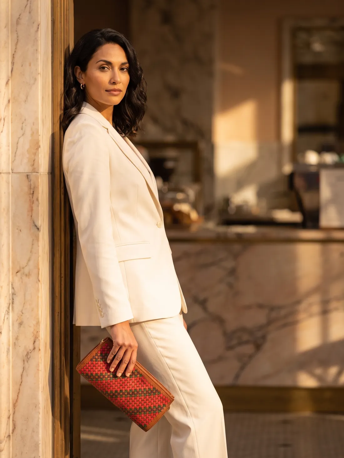GÖN Handmade Kelis Clutch worn — carried in Tan, from the campaign