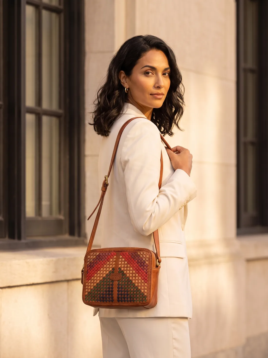 GÖN Handmade Peke Multi Crossbody Bag worn — carried in Tan, from the campaign