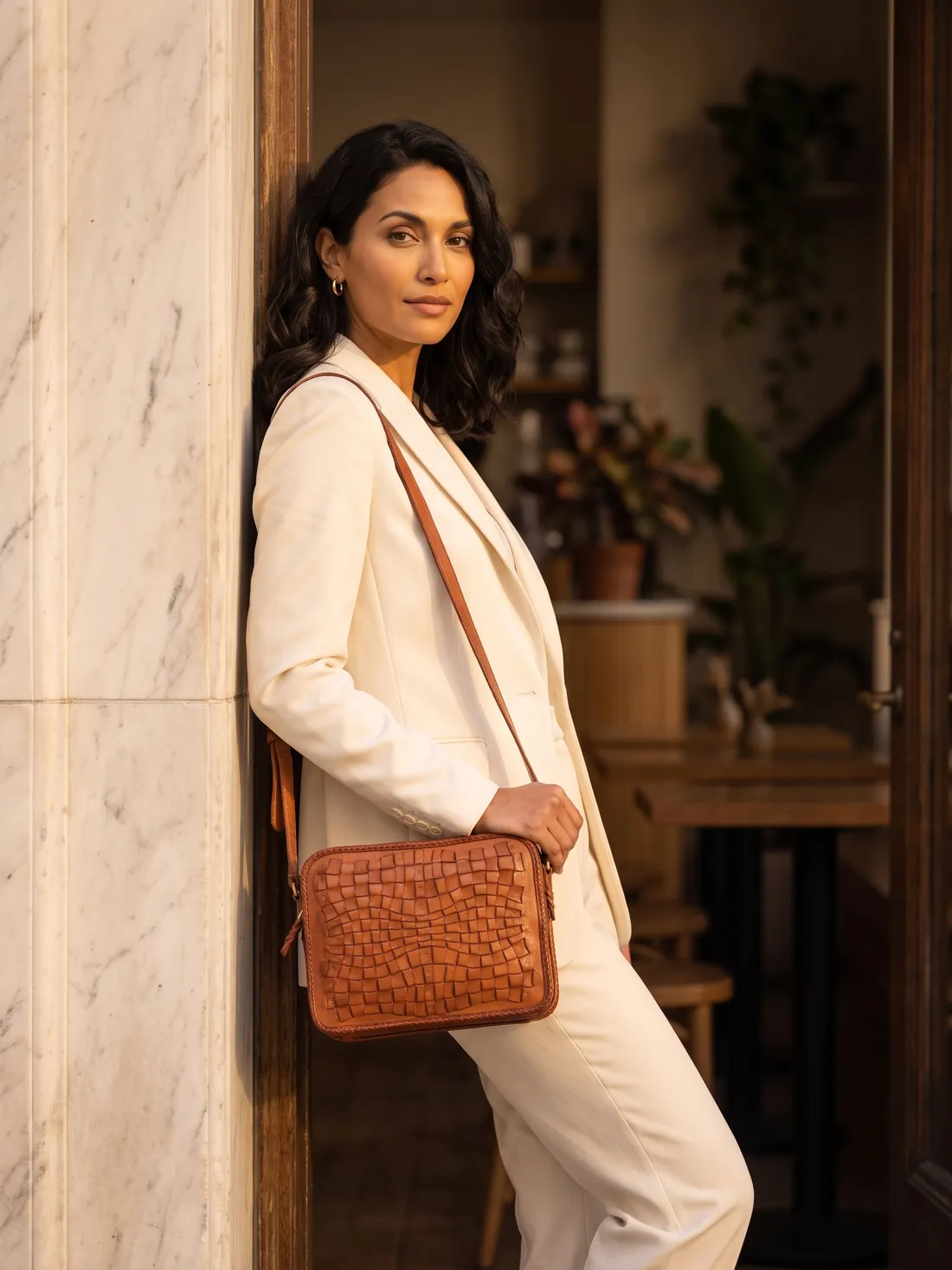GÖN Handmade Fraktal Crossbody Bag worn — carried in Tan, from the campaign