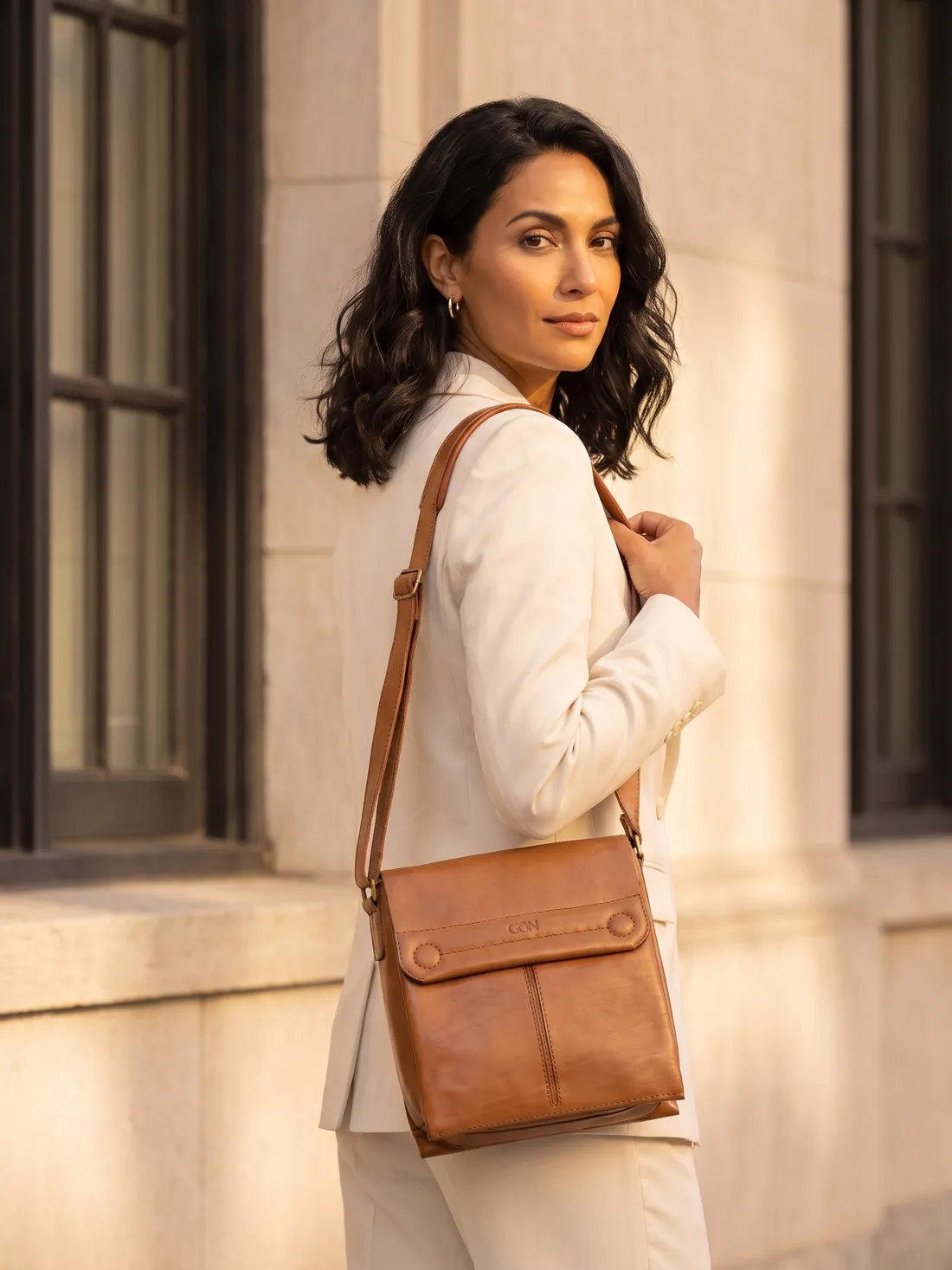 GÖN Handmade Kreko Crossbody Bag worn — carried in Tan, from the campaign