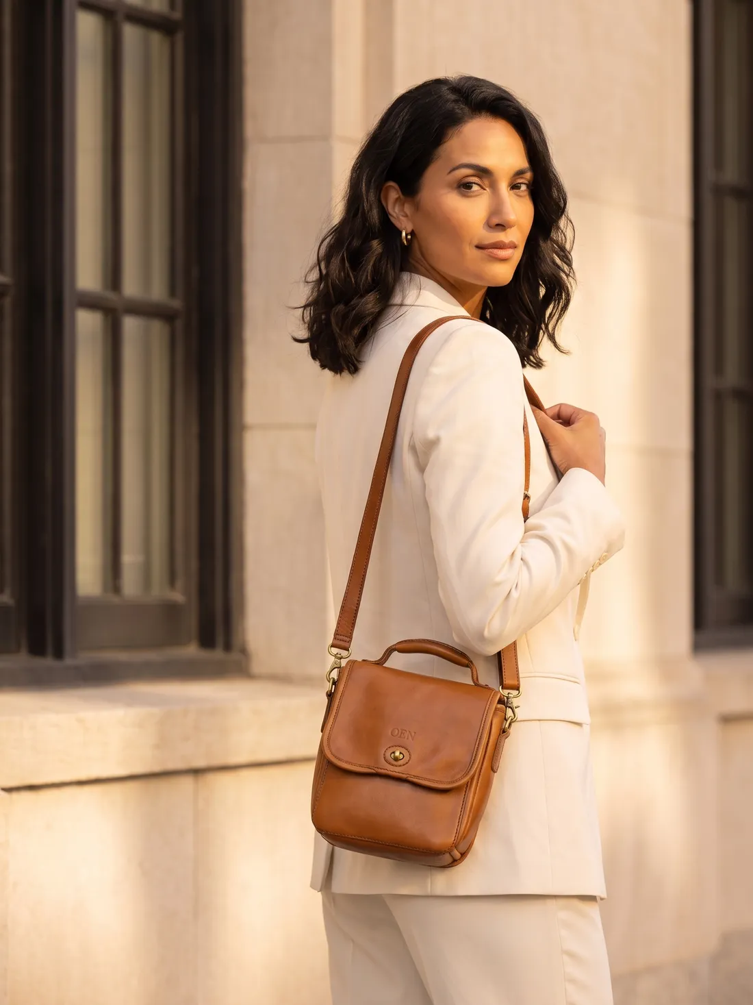 GÖN Handmade Adami Crossbody Bag worn — carried in Tan, from the campaign