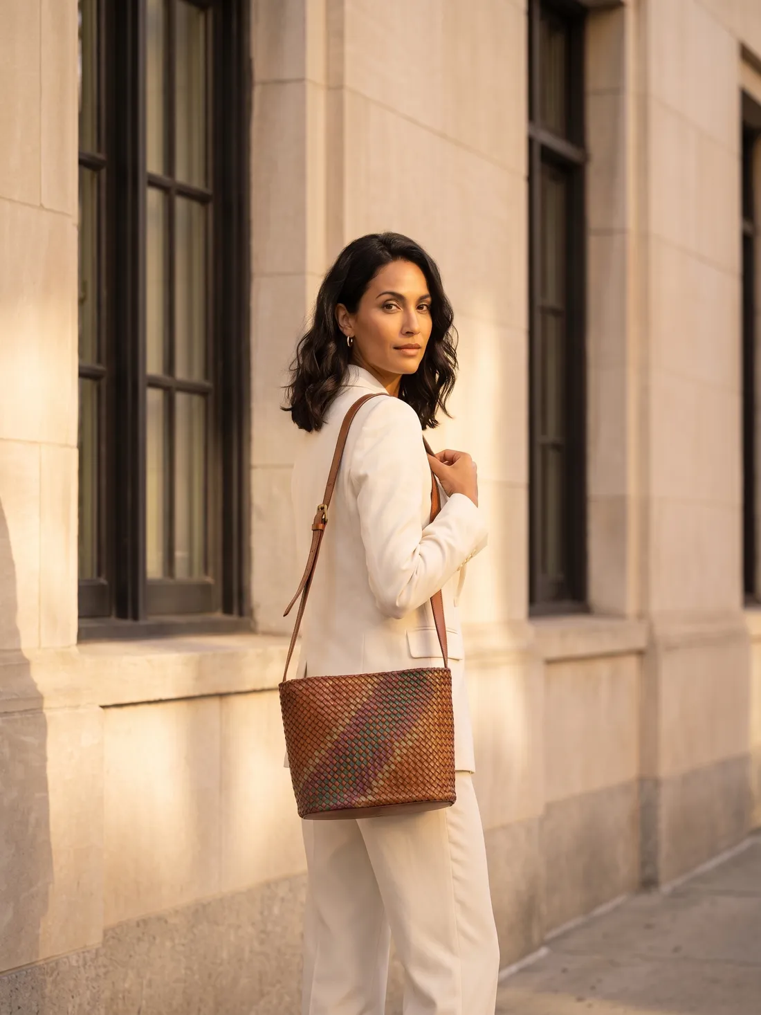 GÖN Handmade Maya Bucket Bag worn — carried in Tan, from the campaign