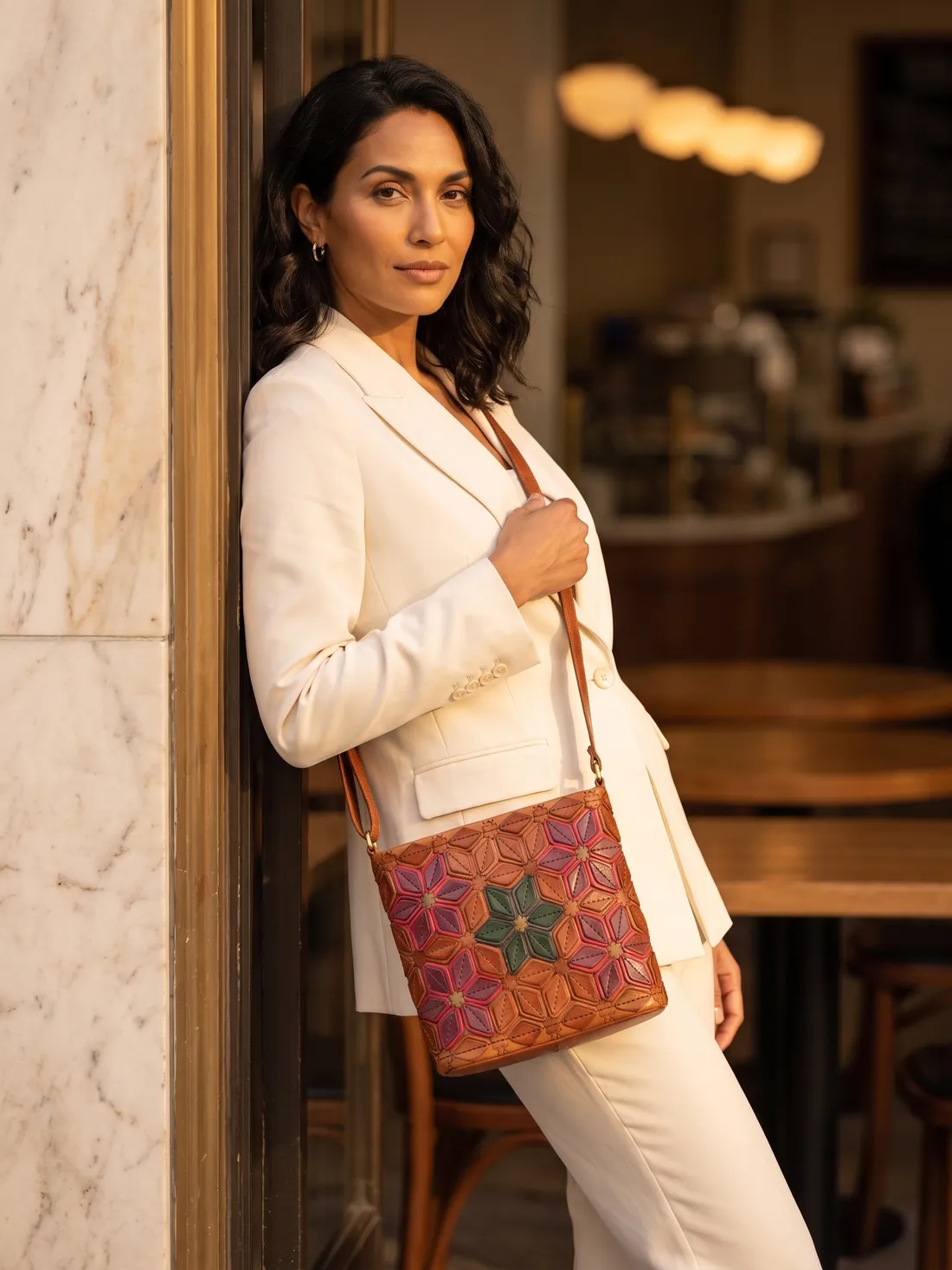 GÖN Handmade Lisa Crossbody Bag worn — carried in Tan, from the campaign