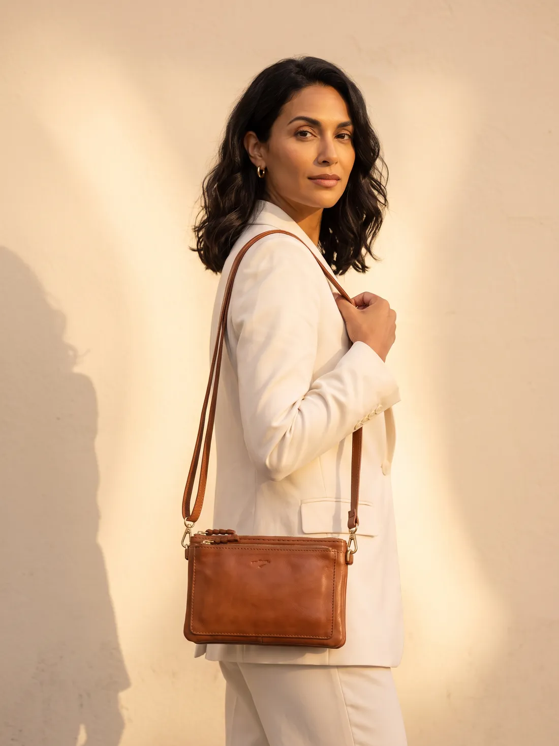 GÖN Handmade Aye Belt Bag worn — carried in Tan, from the campaign