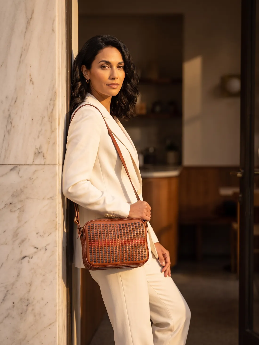 GÖN Handmade Mok Crossbody Bag worn — carried in Tan, from the campaign