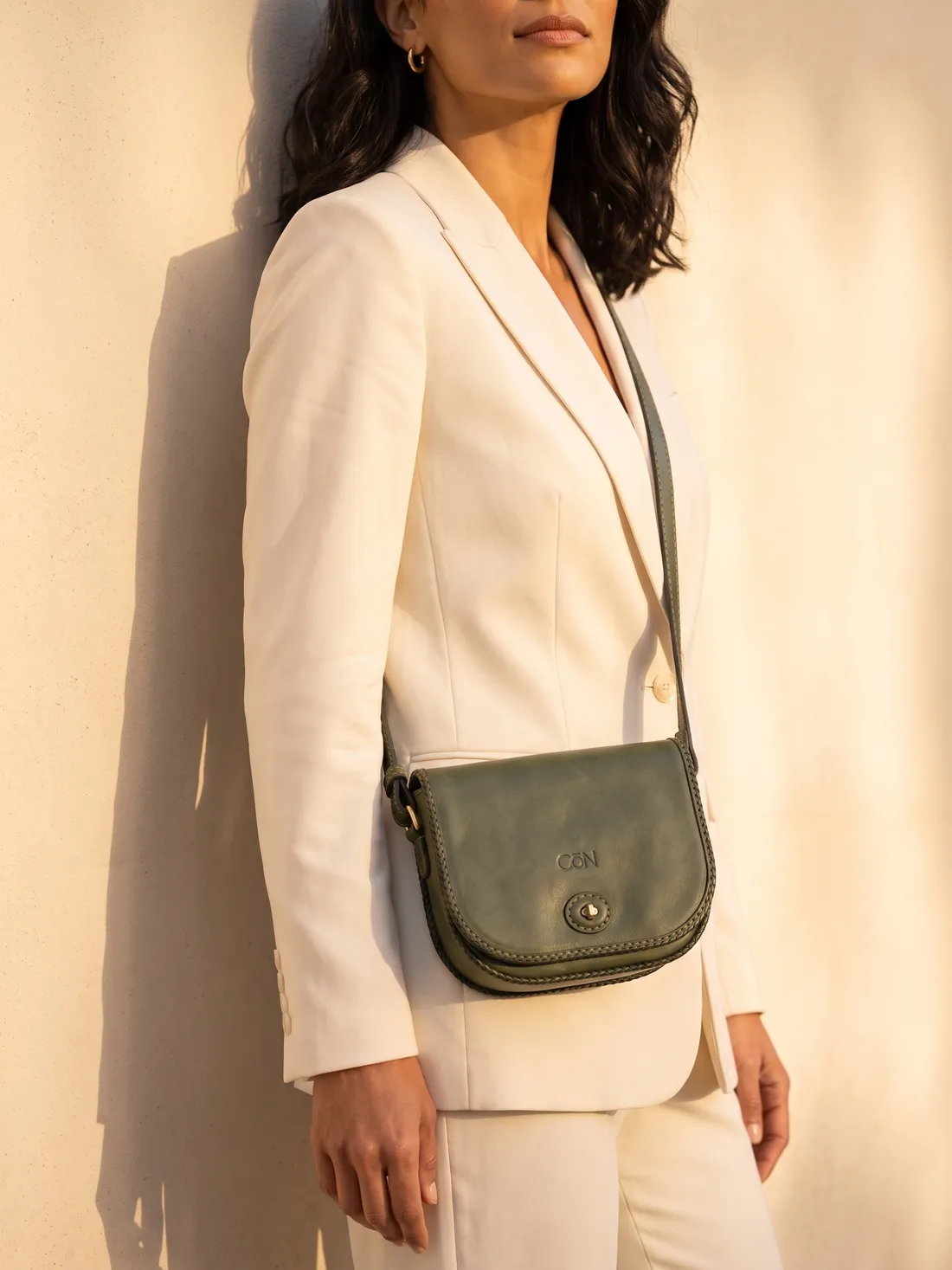 GÖN Handmade Mini Crossbody Bag worn — carried in Olive, from the campaign