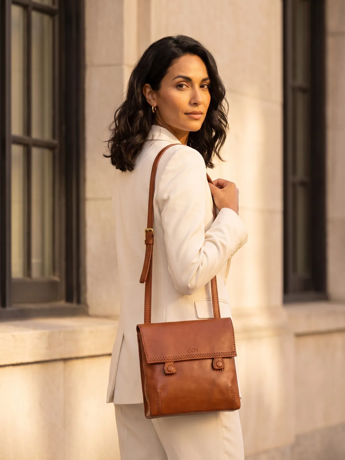 GÖN Handmade Flap Crossbody Bag worn — carried in Tan, from the campaign