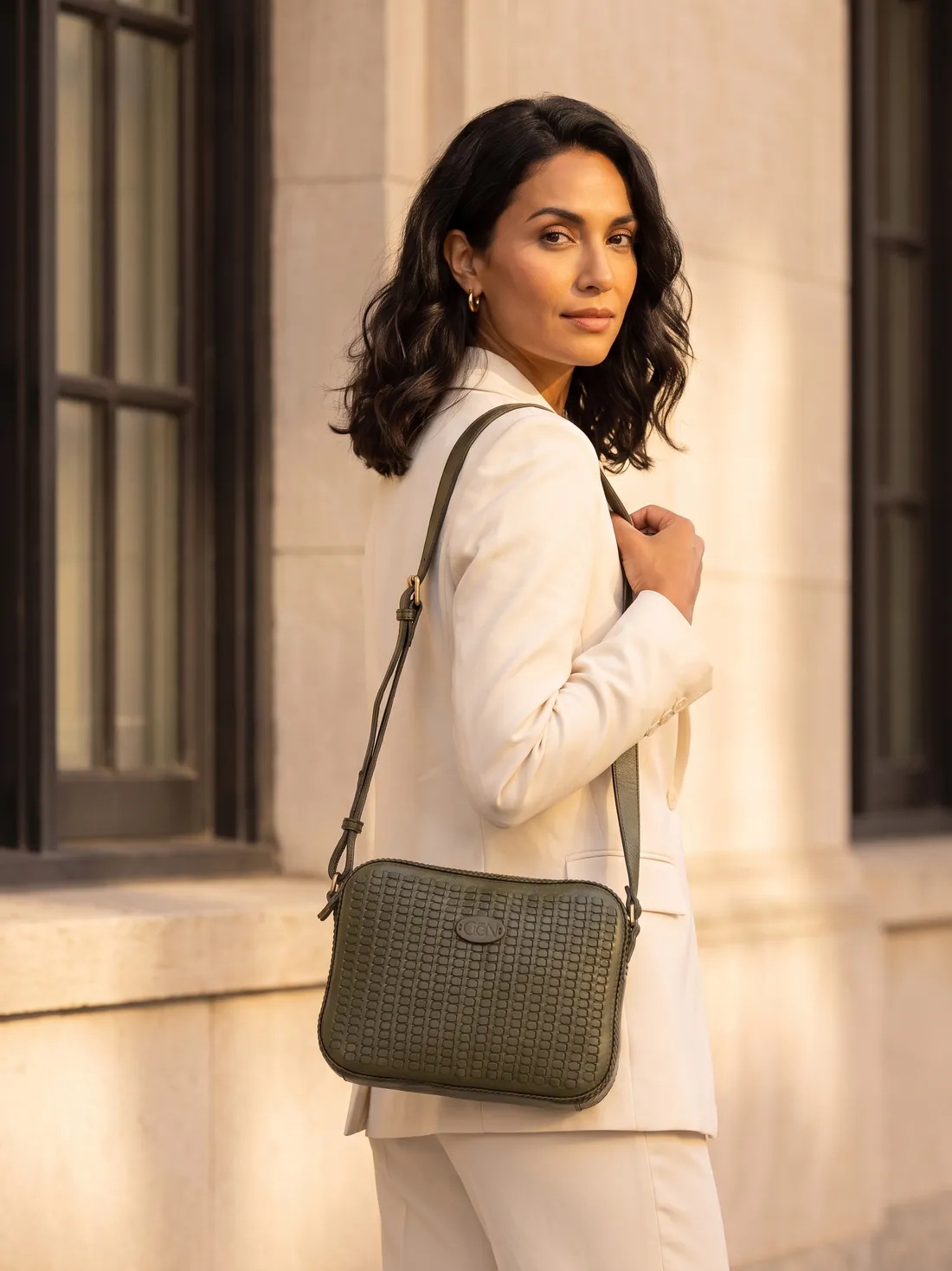 GÖN Handmade Zip-Top Woven Crossbody worn — carried in Olive, from the campaign