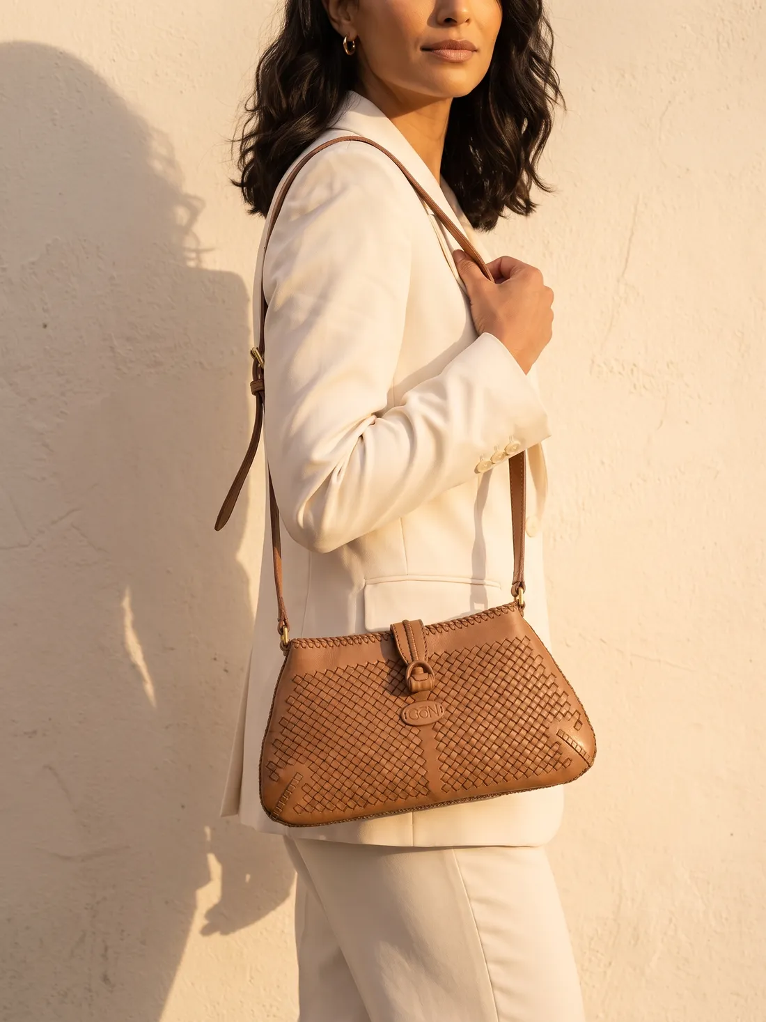 GÖN Handmade Slim Woven Flap Crossbody worn — carried in Camel, from the campaign
