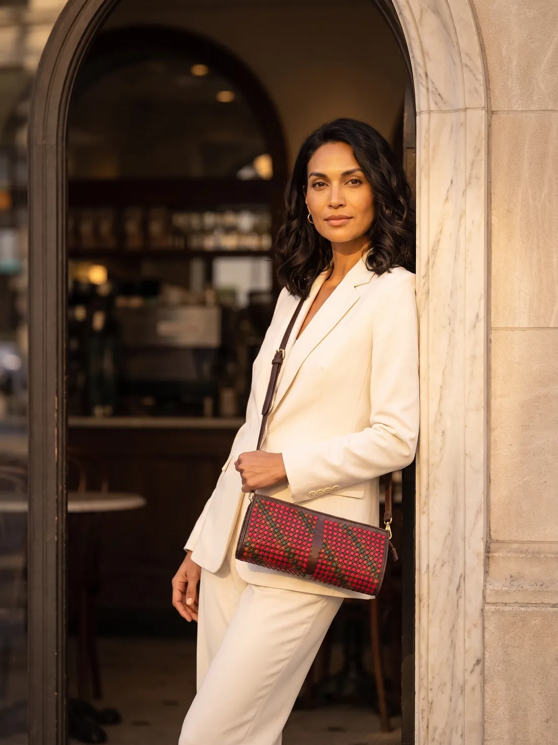 GÖN Handmade Woven Baguette Crossbody worn — carried in Coffee Multi, from the campaign