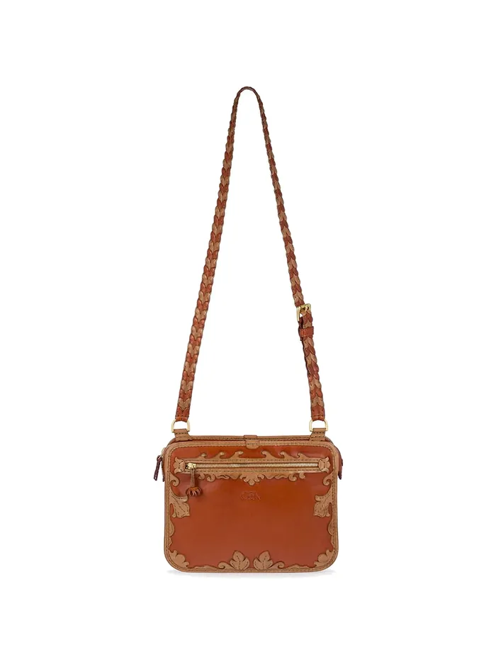 GÖN tan-black leather camera bag with scrollwork trim and braided strap
