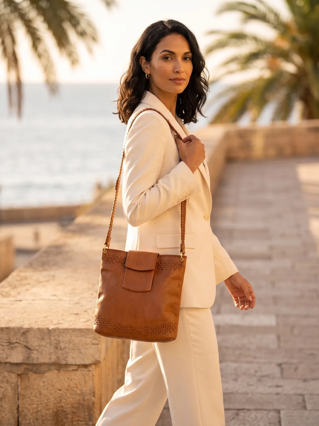 GÖN Handmade Pandam Shoulder Bag worn — carried in Tan, from the campaign