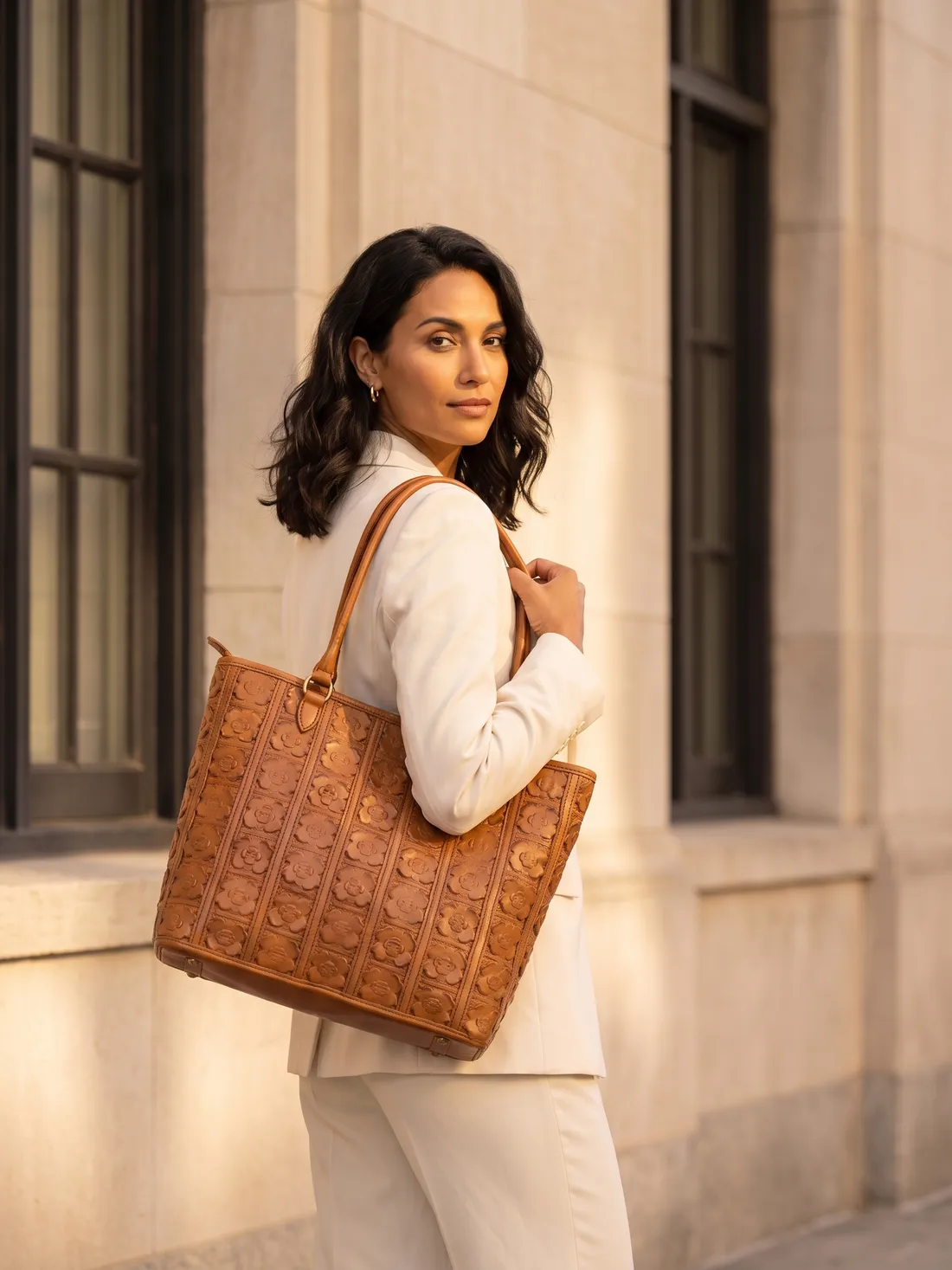 GÖN Handmade Flora Tote worn — carried in Tan, from the campaign