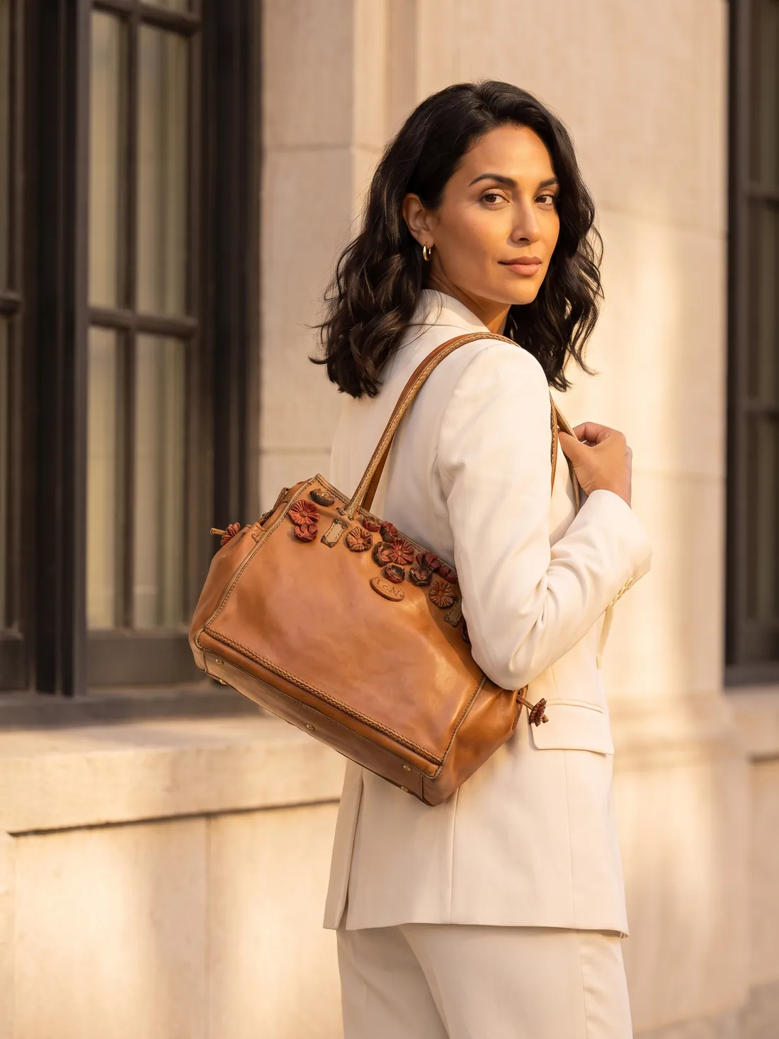 GÖN Handmade Lase Shoulder Bag worn — carried in Tan, from the campaign