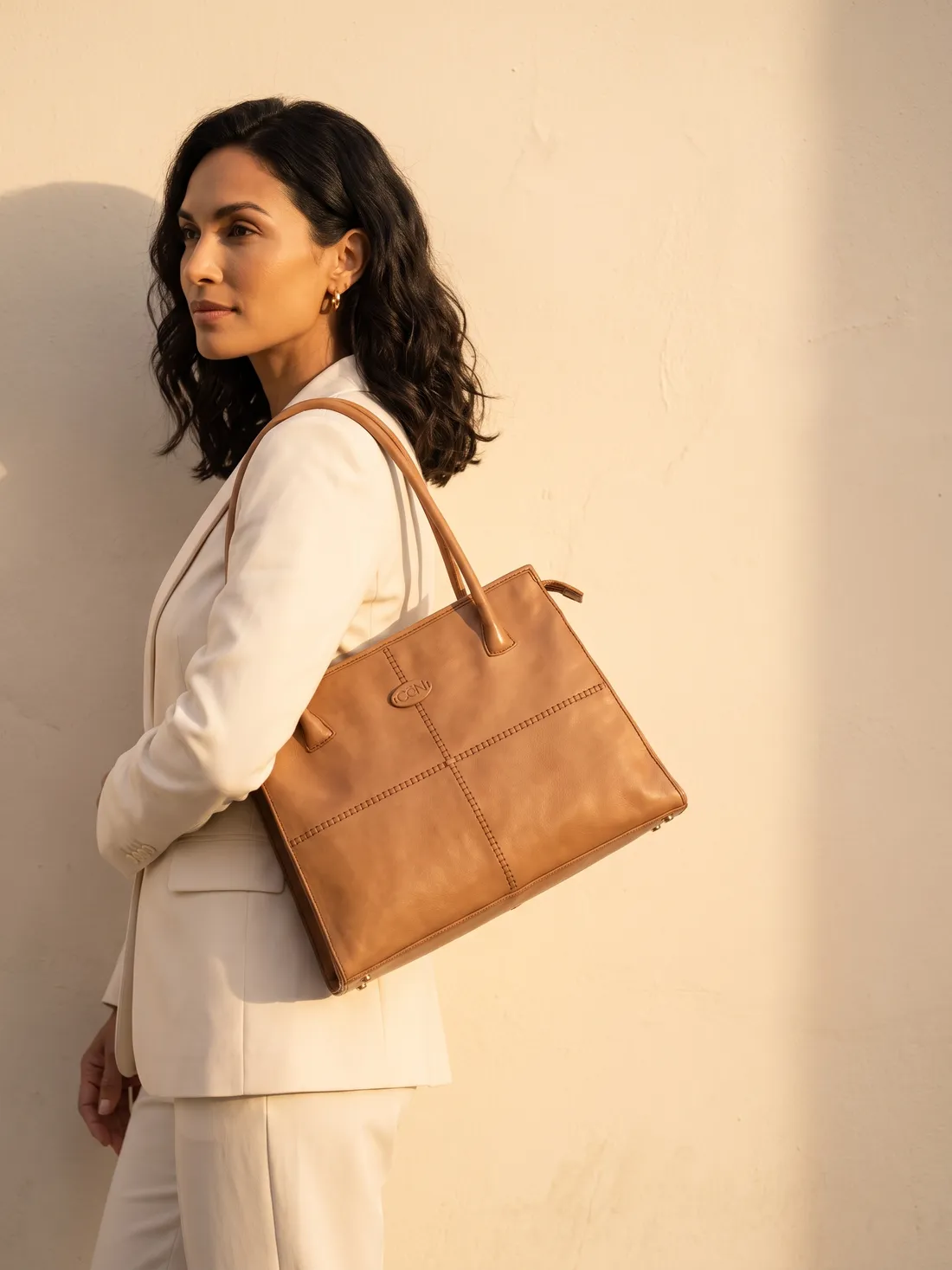 GÖN Handmade Women’s Shoulder Bag worn — carried in Camel, from the campaign