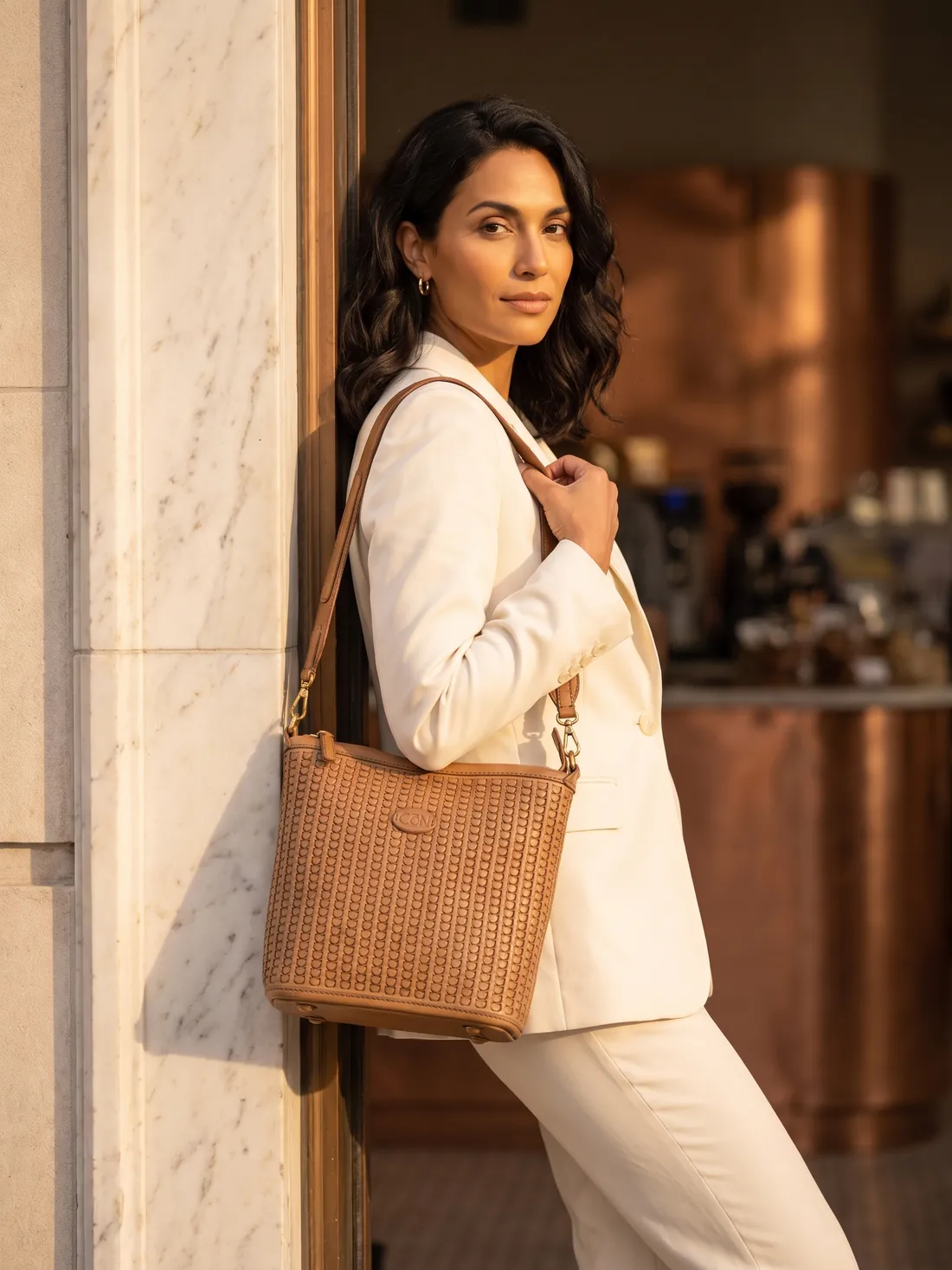 GÖN Handmade Soft Woven Shoulder Bag worn — carried in Camel, from the campaign