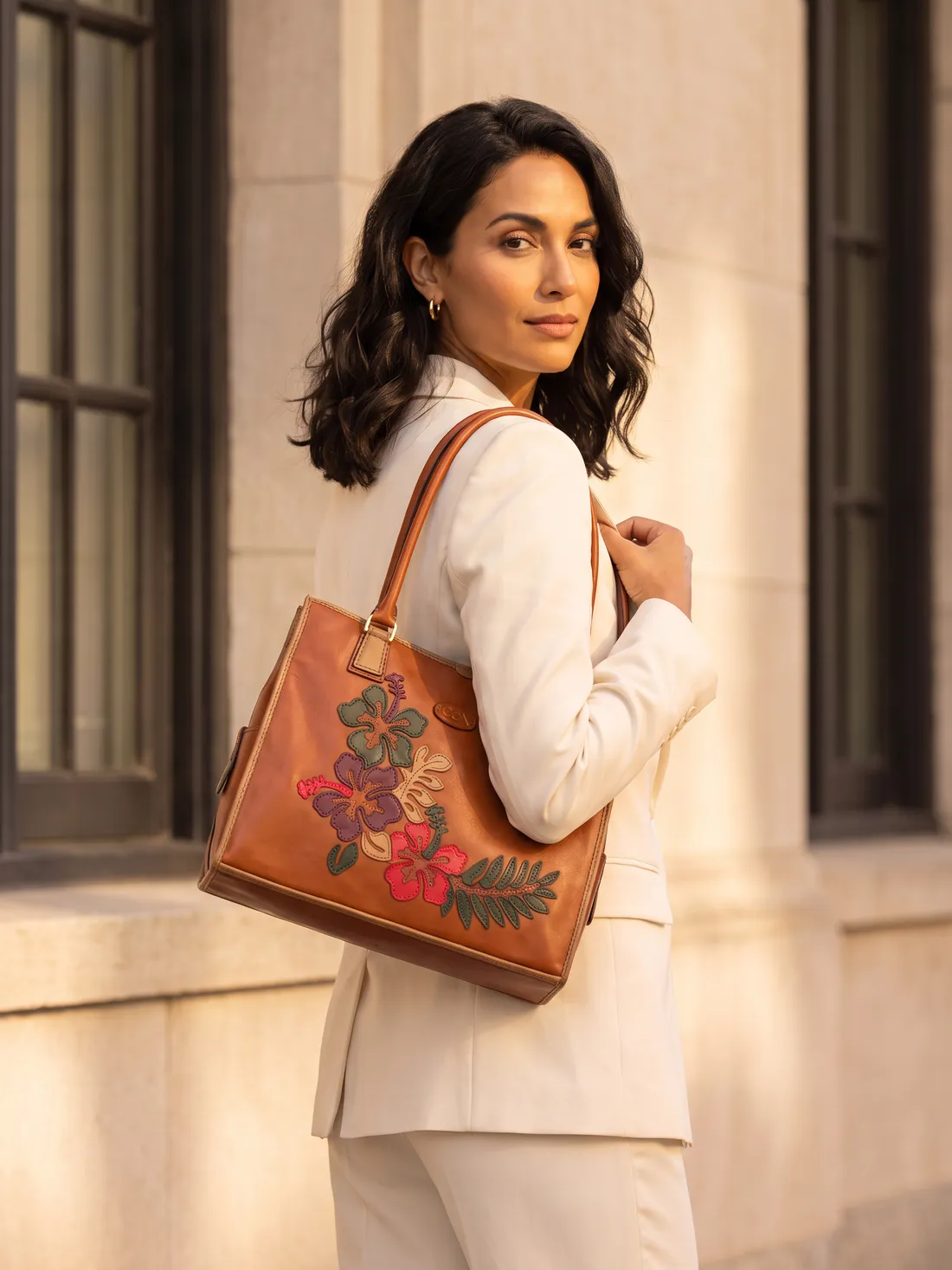 GÖN Handmade Garden Appliqué Tote worn — carried in Tan Multi, from the campaign