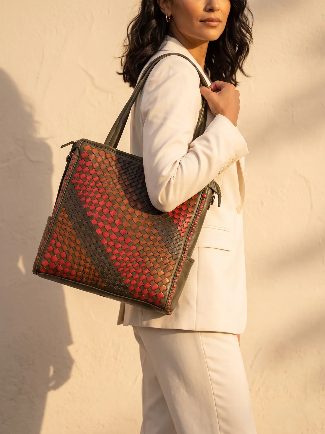GÖN Handmade Diagonal-Weave Tote worn — carried in Olive Multi, from the campaign