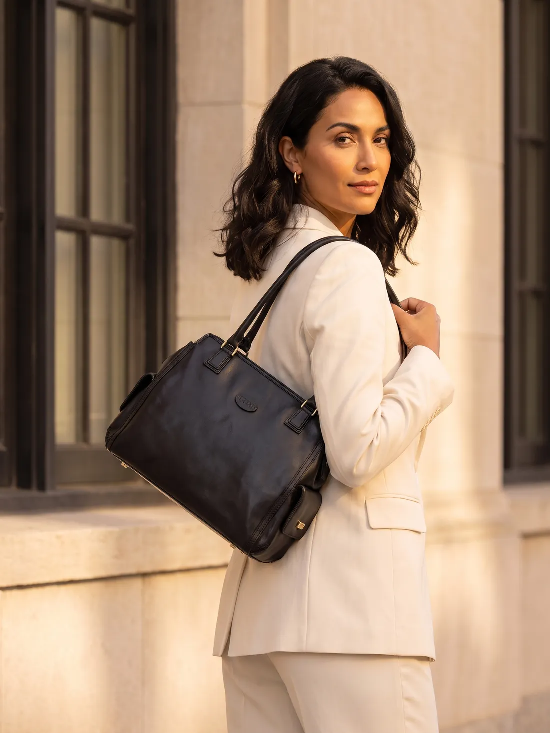 GÖN Handmade Structured Shoulder Bag worn — carried in Black, from the campaign