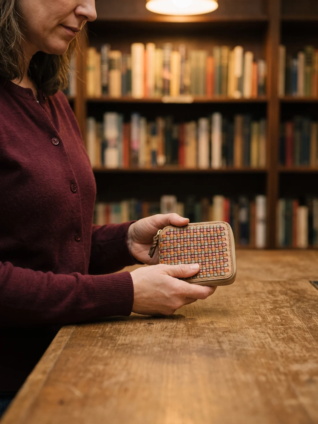 GÖN Handmade Woven Square Wallet worn — carried in Gray Multi, from the campaign