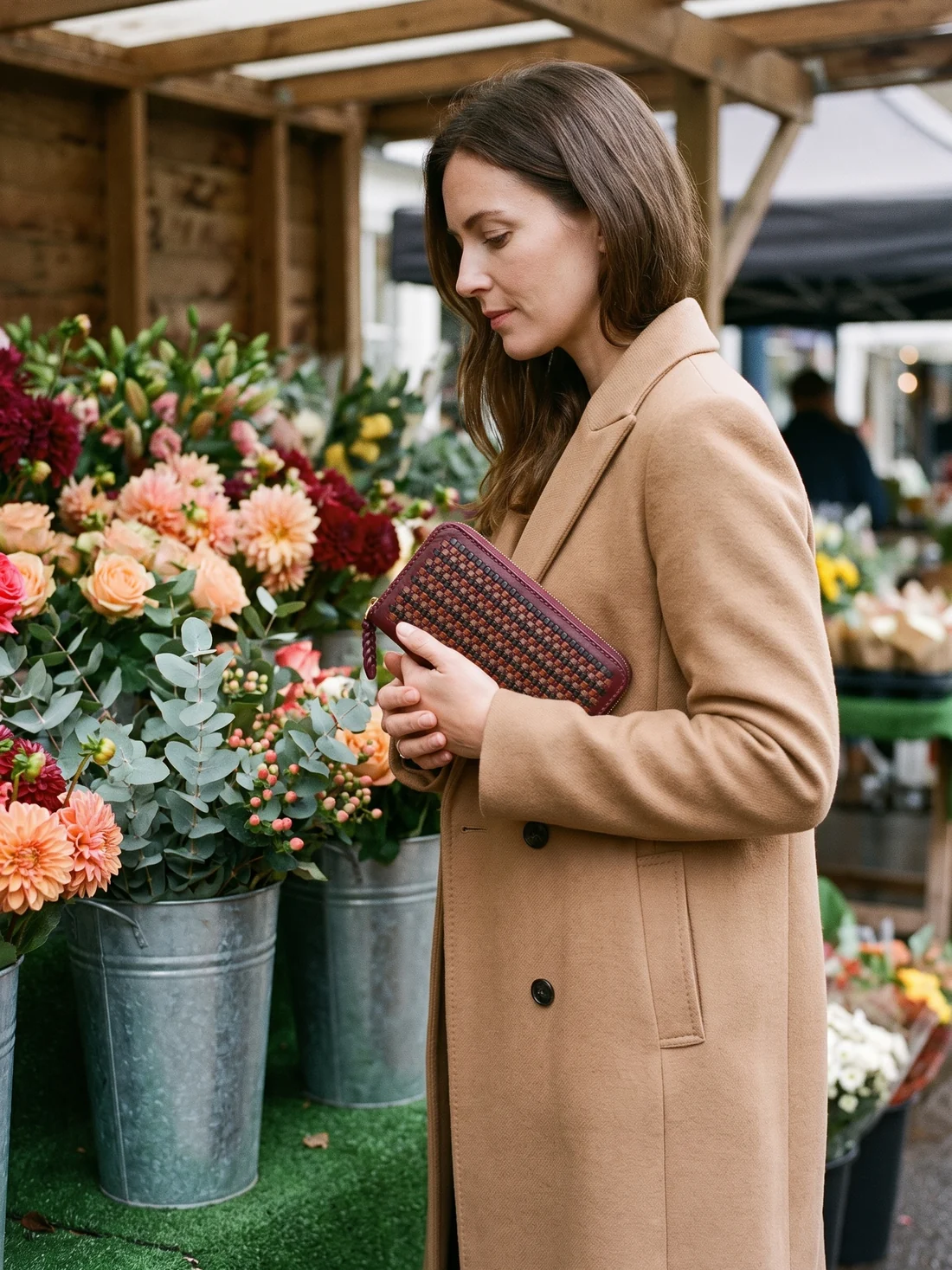 GÖN Handmade Two-Tone Woven Wallet worn — carried in Plum Multi, from the campaign